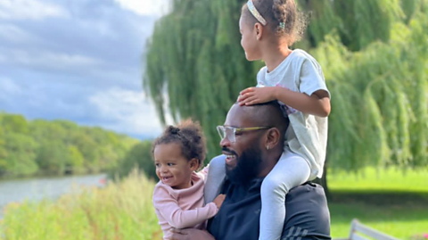 Ugo Monye with his 2 daughters.