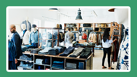 Photograph of a stylish men's fashion shop with clothing displays