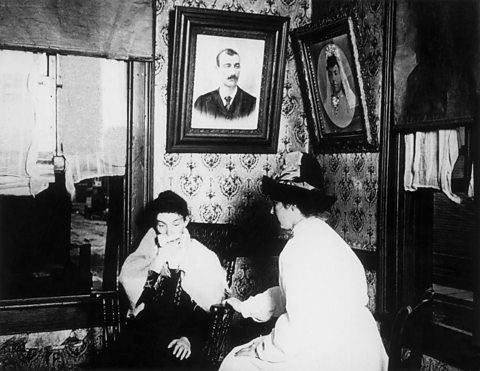 A nurse visiting the home of a patient suffering from tuberculosis, 1904.