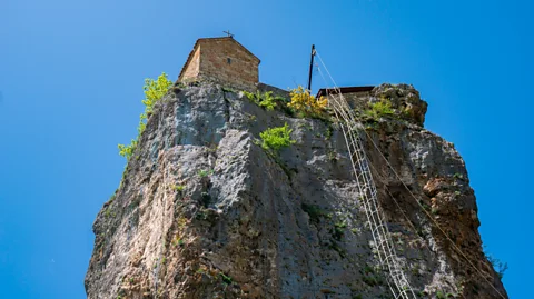 k_samurkas/Getty Images Only one monk is allowed in the church at a time, so they take turns to scale the ladder once or twice a week (Credit: k_samurkas/Getty Images)