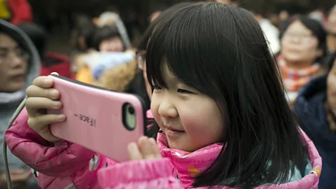 Nicolas Asouri/AFP/Getty Images The evidence on when is the right time to give a child their own smartphone is poor, but there are key moments where the risks are higher (Credit: Nicolas Asouri/AFP/Getty Images)