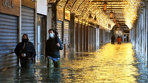 A.Pattaro/Getty Images A flooded St. Mark's Square in December 2020 following an "alta acqua" event. The Mose gates were not lifted (Credit: A.Pattaro/Getty Images)