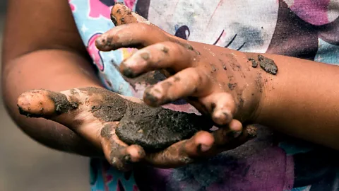 Getty Images Kneading materials like mud or sand can help children develop the way their senses and movement interact (Credit: Getty Images)