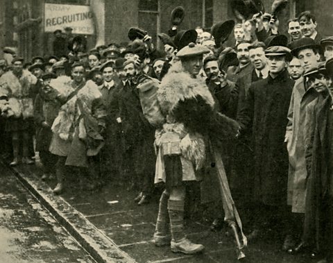 A recruitment drive with Scottish soldiers and would-be recruits, World War One.