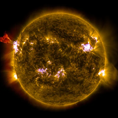 Nasa Solar flares (seen bursting on the left) and eruptions of material from the Sun known as coronal mass ejections are one source of high energy particles from space (Credit: Nasa)