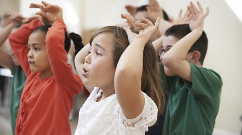 Primary school children taking part in classroom activity