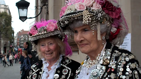 Colin Underhill/Alamy Pearly uniforms are decorated with a dazzling array of mother-of-pearl buttons and their symbols represent different values (Credit: Colin Underhill/Alamy)
