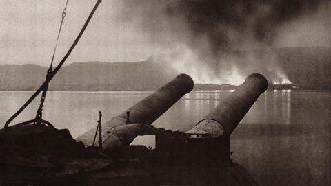 Fires on the shores of the Dardanelles Strait seen from the H.M.S. Cornwallis, the last British ship to leave the Dardanelles after the Allied forces were evacuated.