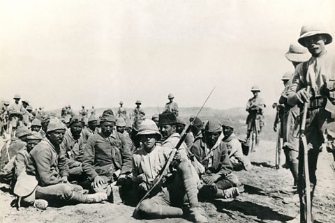 Turkish prisoners of war with guarded by British soldiers, Mesopotamia (now Iraq), WW1.