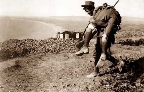 An Australian soldier bringing in a wounded comrade to a hospital, Gallipoli campaign, 1915.