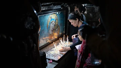 Anthon Jackson Worshippers pack into the sacred crypt of the historical church of Mostorod (Credit: Anthon Jackson)