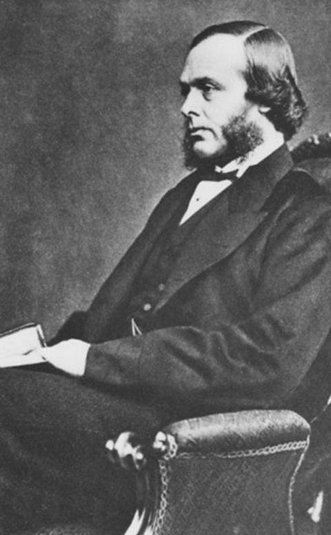 A black and white photograph of Joseph Lister sitting in a chair facing to the left