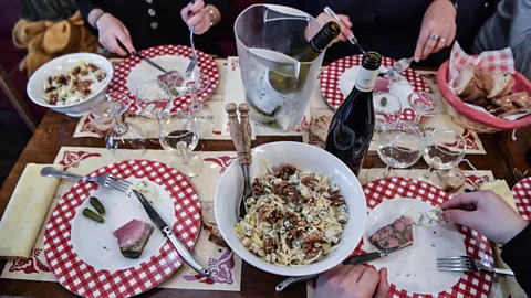 Philippe Desmazes/Getty Images Lyon's meat-heavy mâchon includes offal-based dishes washed down with Beaujolais wine (Credit: Philippe Desmazes/Getty Images)
