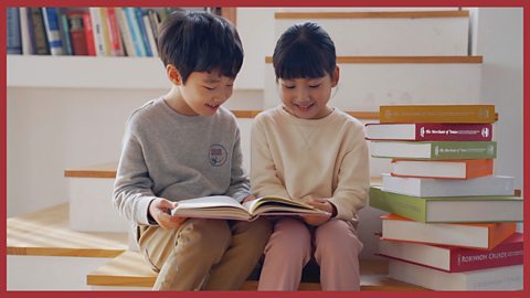 Image: Children reading surrounded by books