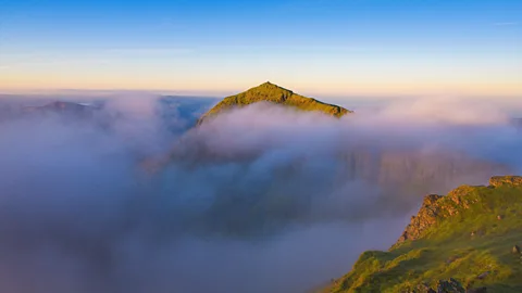 Alamy An uncommon cloud inversion on the Welsh mountain Yr Wyddfa (formerly known as Snowdon) (Credit: Alamy)