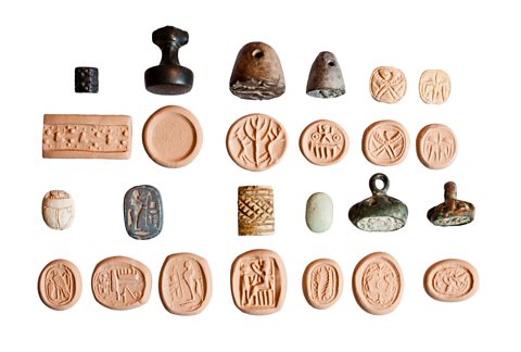 A collection of historic stamps and seals on a white background