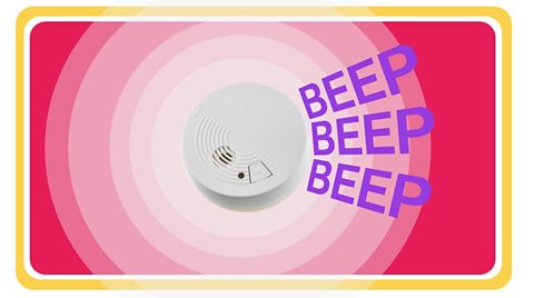 Smoke alarm against coloured background.