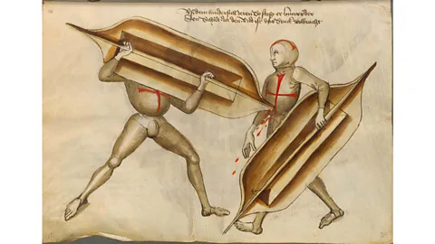 Alamy In addition to the long sword, Talhoffer teaches readers how to fight with more specialised weapons such as "Stechschilde"– thrusting shields (Credit: Alamy)