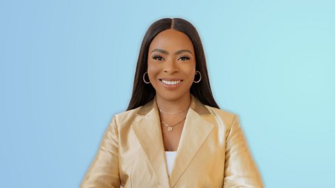 Tiwalola Ogunlesi smiling at the camera. She is wearing a golden jacket and standing in front of a baby blue background.