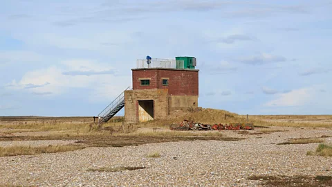 Geography Photos/Getty Images The coastline is awash with mysteries and legends about the facility’s secret past (Credit: Geography Photos/Getty Images)