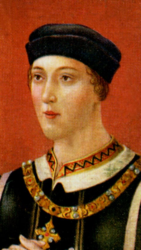 A painted portrait of King Henry VI, he is looking to the left, wearing a black skullcap, gold jewellery with his hands clasped in front of him.