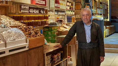 Simon Urwin Nasir sells his honey at the natural health food store Dukani Mam Hajy in Shaqlawa (Credit: Simon Urwin)
