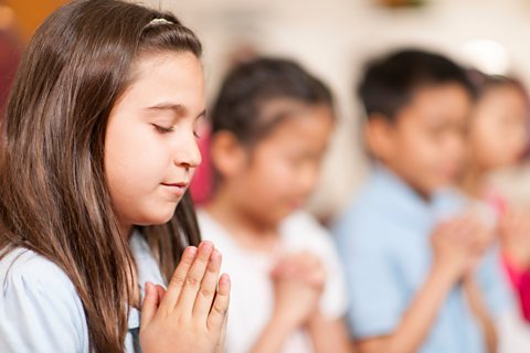 Children in prayer.