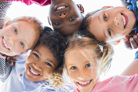 A circle of smiling children.