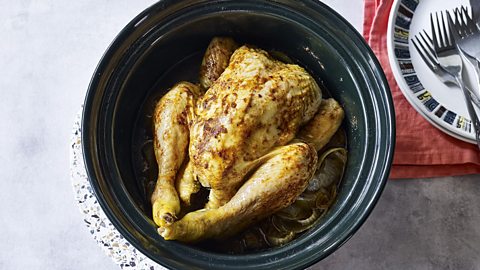 A roast chicken inside an air fryer