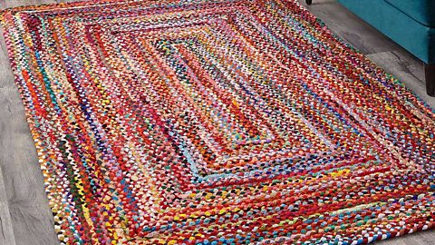 A large colourful rug with concentric squares