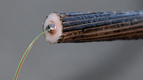 Boris Horvat/Getty Images Telecommunications cables provide the information pathways for more than 95% of international data (Credit: Boris Horvat/Getty Images)