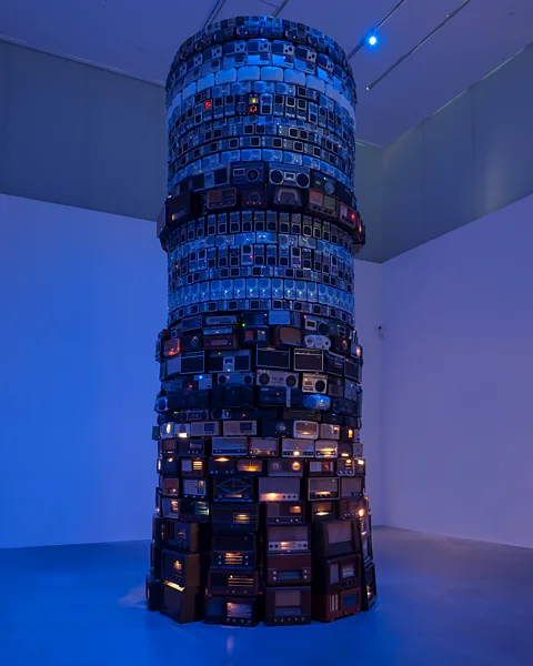 Cildo Meireles/ Tate The totemic artwork Babel, 2001, by Brazilian artist Cildo Meireles is a tower of hundreds of analogue radios, all tuned to different stations (Credit: Cildo Meireles/ Tate)