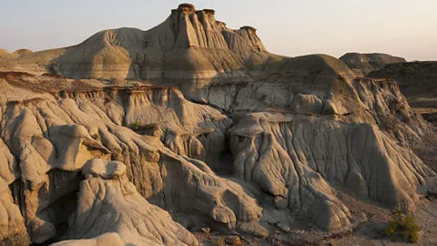 Getty Images The carved outcrops of stripy rock in the badlands of Alberta, Canada make a perfect hunting ground for dinosaur fossils (Credit: Getty Images)