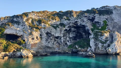 L J Coffey More than 100 burial caves are hewn into the rocks at Cales Coves (Credit: L J Coffey)