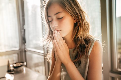 A girl praying.