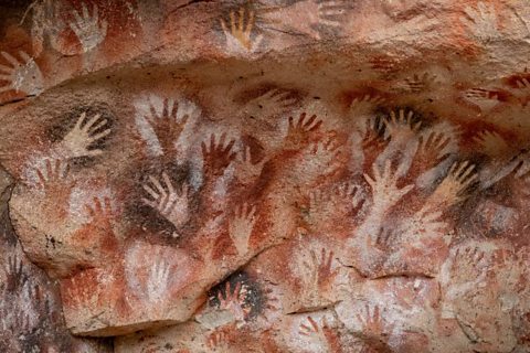 Handprints on rock at Cueva de las Manos in Argentina.