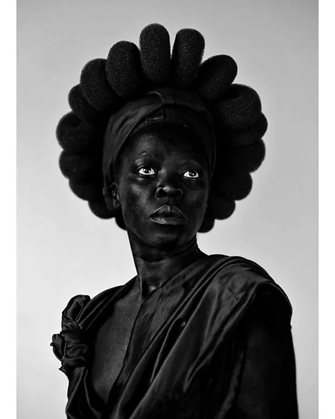 Zanele Muholi Ntozakhe ll, Parktown (2016) from the series Somnyama Ngonyama, in which Muholi depicts themself in various different guises (Credit: Zanele Muholi)