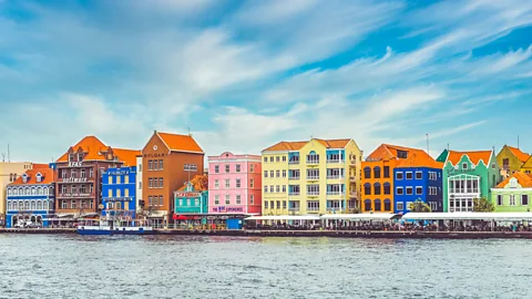 Lisa5201/Getty Images Willemstad, Curacao's capital, is characterised by its vibrant architecture (Credit: Lisa5201/Getty Images)