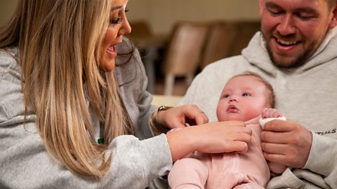 Charlotte and Jake playing with baby Alba.