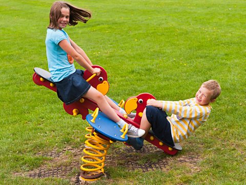 Children on a seesaw.