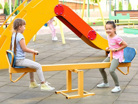 Children on a seesaw.