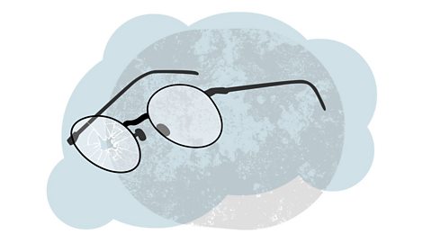 A pair of glasses with one lens smashed