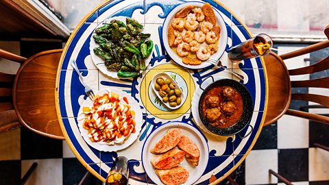 Table with tapas dishes on it 