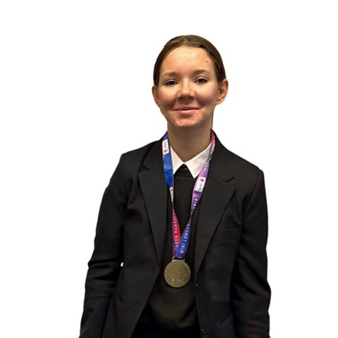 Teenager Plamena wearing the medal she won as part of the Mini London Marathon project