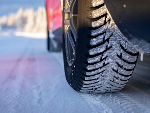 Car tyres on a snowy road.