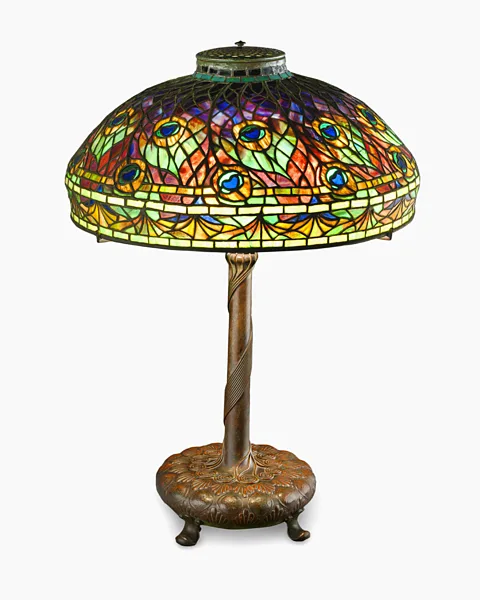 MMFA, Jean-François Brière The Peacock table lamp, about 1905, was designed by Clara Driscoll for Tiffany Studios in New York (Credit: MMFA, Jean-François Brière)