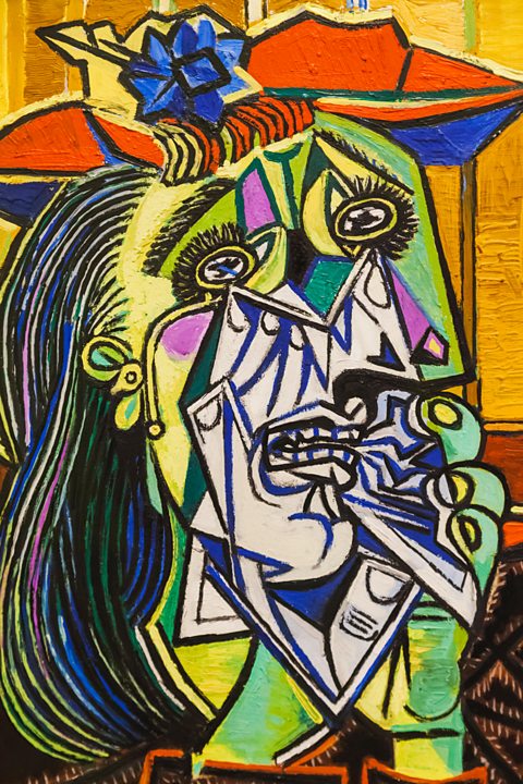 Weeping Woman by Pablo Picasso, showing a woman's face made up of many different colours and shapes.