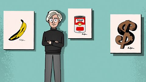 Andy Warhol is standing in front of three of his famous prints: the banana, soup can and dollar sign