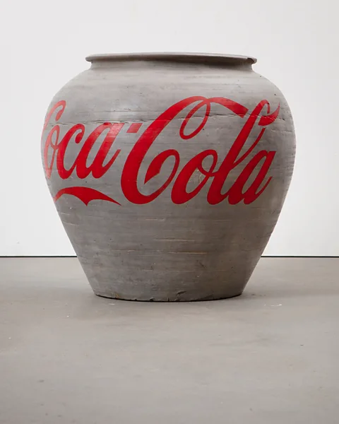 Courtesy of Ai Weiwei studio Han Dynasty Urn with Coca-Cola Logo, 2014 – Ai has been exploring ancient artefacts in his work from the start of his career (Credit: Courtesy of Ai Weiwei studio)