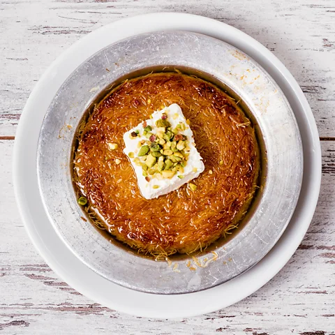 OZMedia/Alamy Künefe topped with kaymak and pistachios (Credit: OZMedia/Alamy)